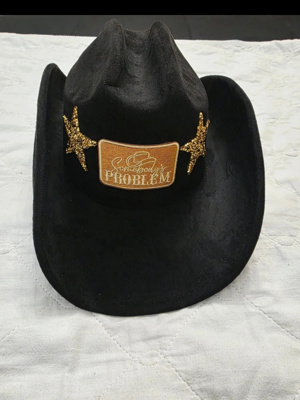 Black Cowboy Hat with Gold 'Somebody's Problem' Patch